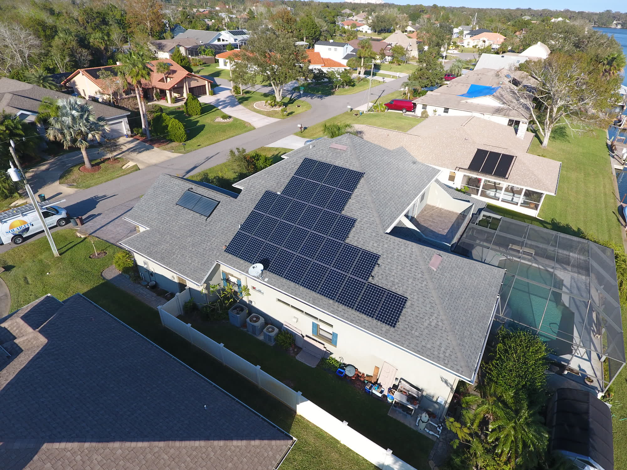 Aerial view of a Palm Coast neighborhood with Solar-Fit rooftop arrays
