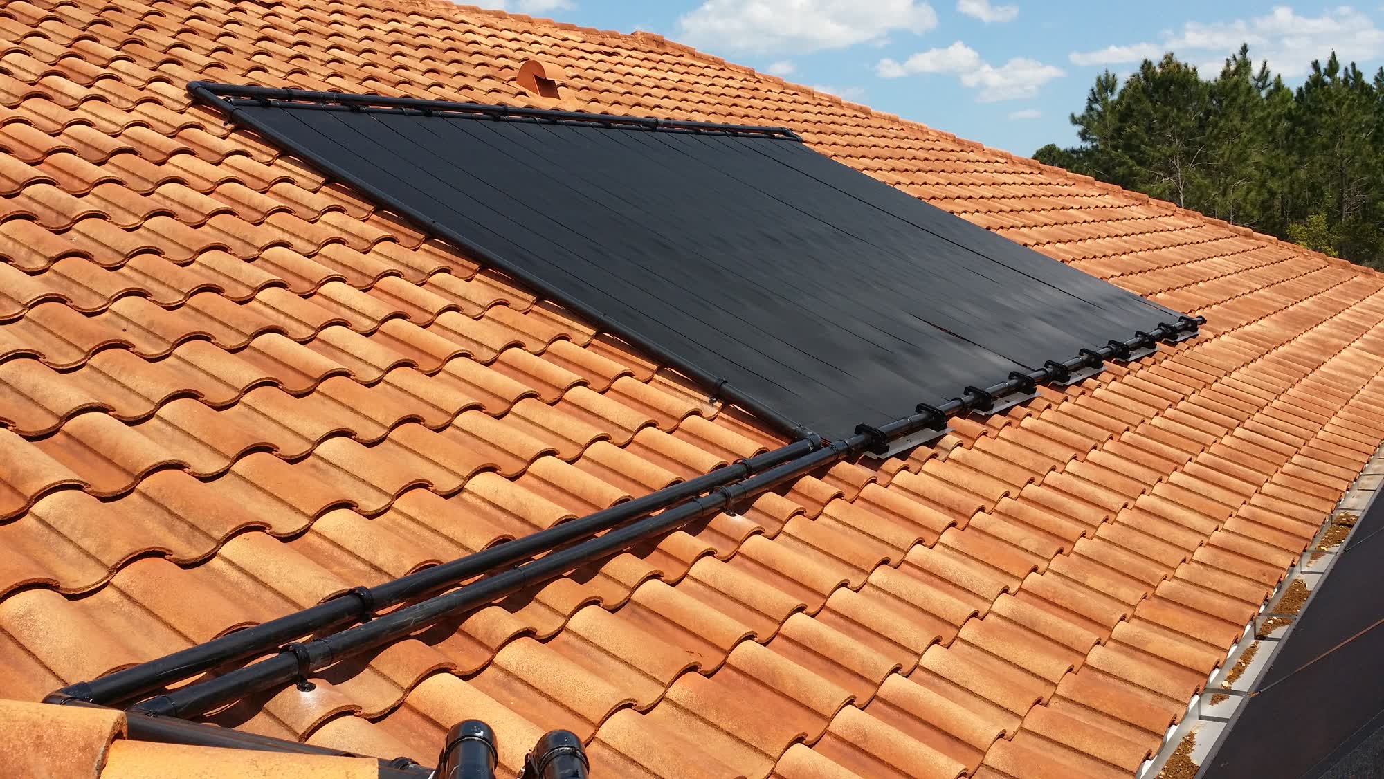 Solar panels on a barrel-tile roof in Palm Coast